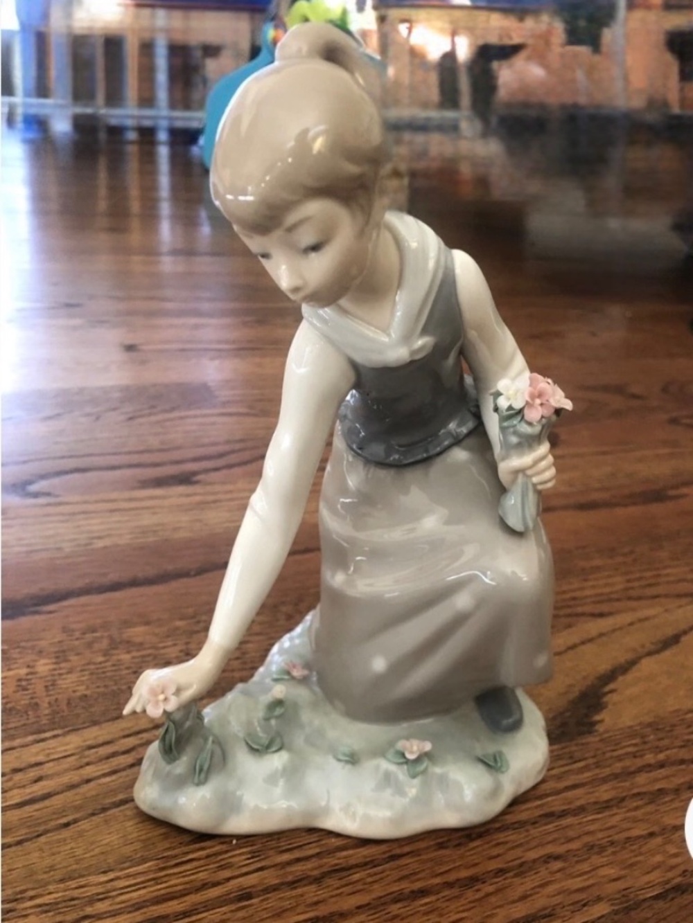 Lladro porcelain figurine titled "Girl Gathering Flowers".  PERFECT CONDITION